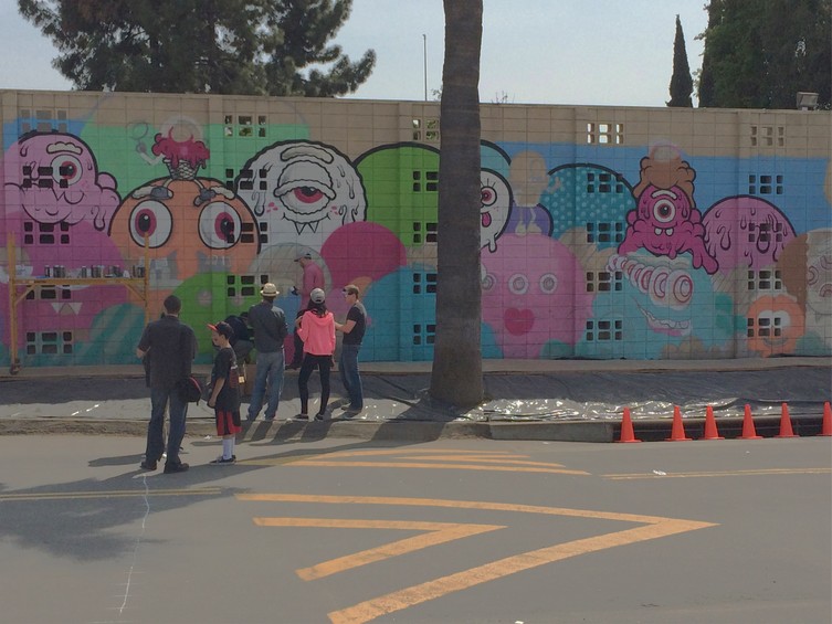 Mural design by Buff Monster | Painted by people in the neighborhood - mostly kids!
